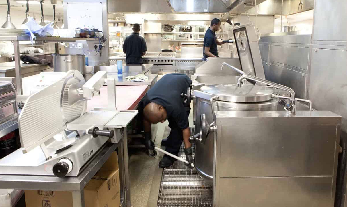 Florida kitchen pros performing kitchen cleaning service in a commercial kitchen