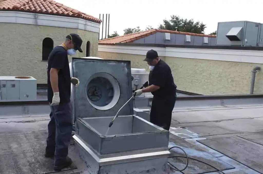 Technicians cleaning a rooftop ventilation system in Zephyrhills